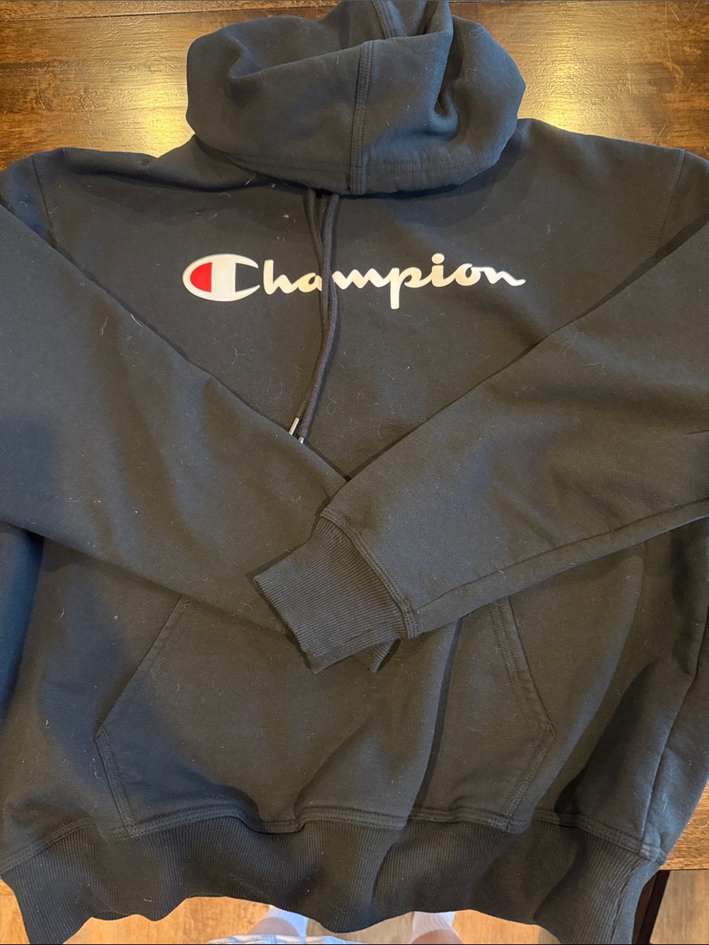 Champion Black Hoodie with Script Logo and Red Accent